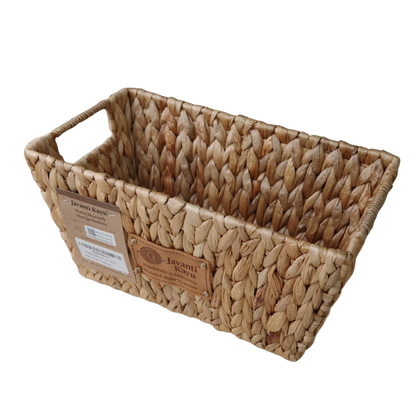 Handwoven water hyacinth storage basket with cutout handles and Javanti Kayu label