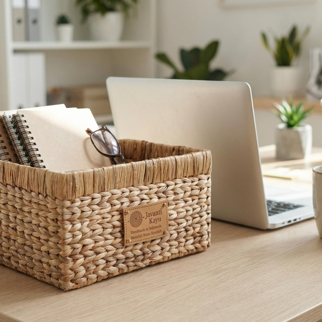 Mid basket on a desk beside a laptop and notebooks