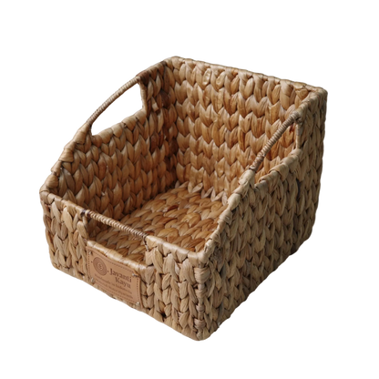 Open-front water hyacinth pantry bin with slanted cutout and woven handles