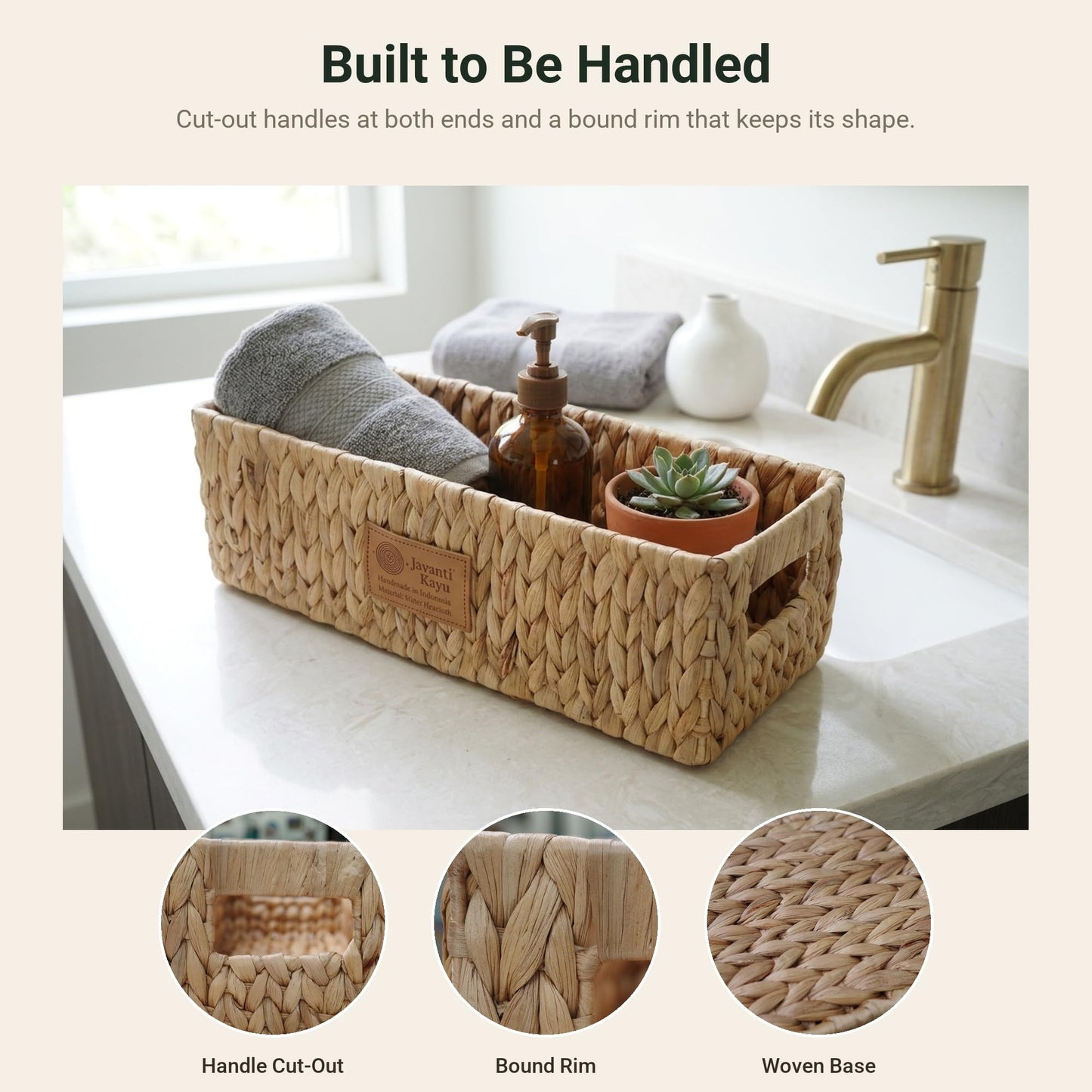 Long water hyacinth basket on a bathroom counter holding a towel and soap dispenser