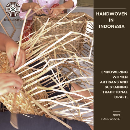 Women artisans in Indonesia weaving water hyacinth baskets by hand