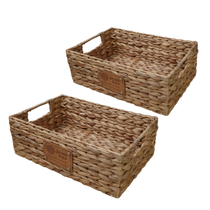 Two medium handwoven water hyacinth baskets with woven-in handles