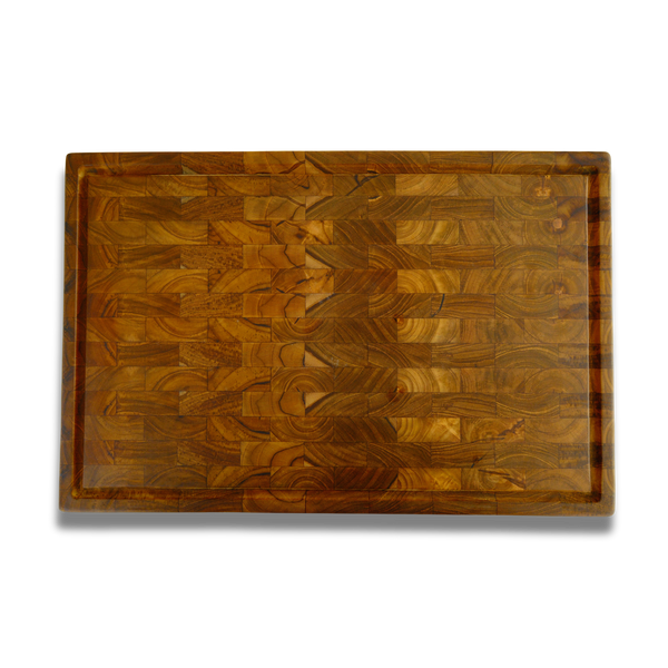 End-grain teak cutting board with juice groove — checkerboard grain, top view