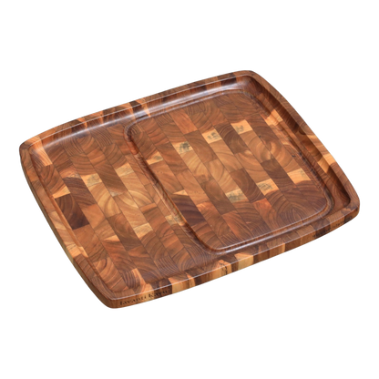 Solid teak end-grain steak plate with juice groove, divided zone, and engraved Javanti Kayu logo