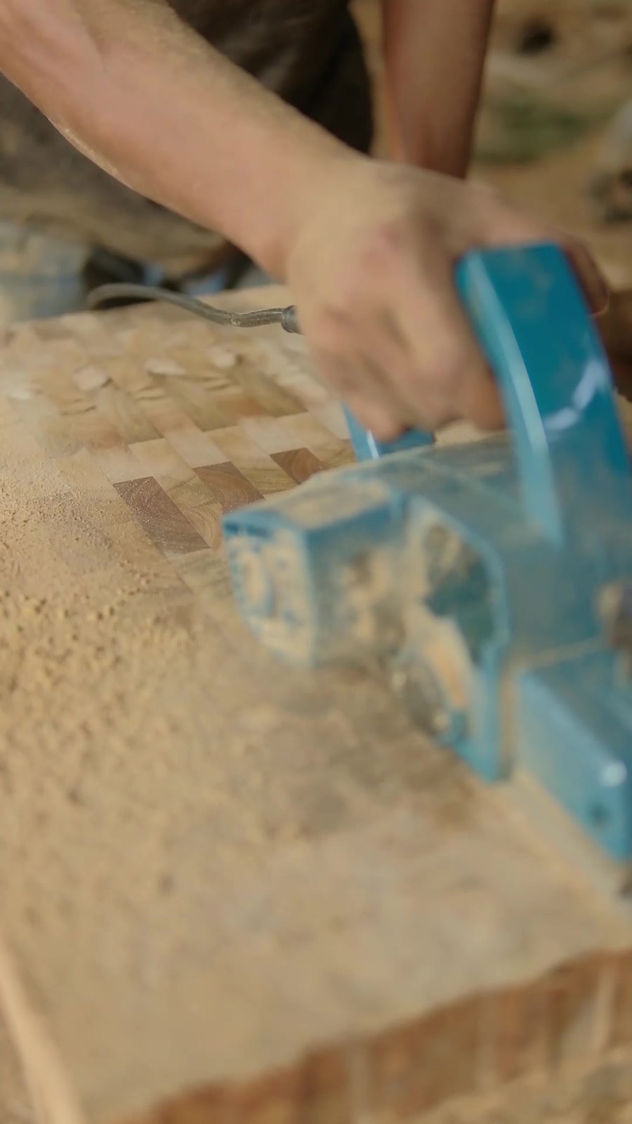Teak steak plate being planed by hand